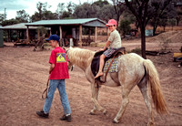 Sam leading Rowan on horse